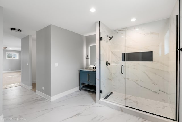 bathroom featuring vanity and a shower with shower door