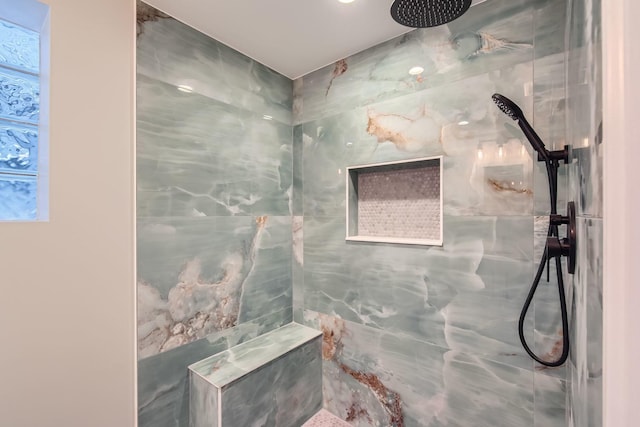 bathroom featuring a tile shower