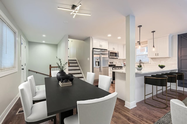 dining space featuring dark hardwood / wood-style floors