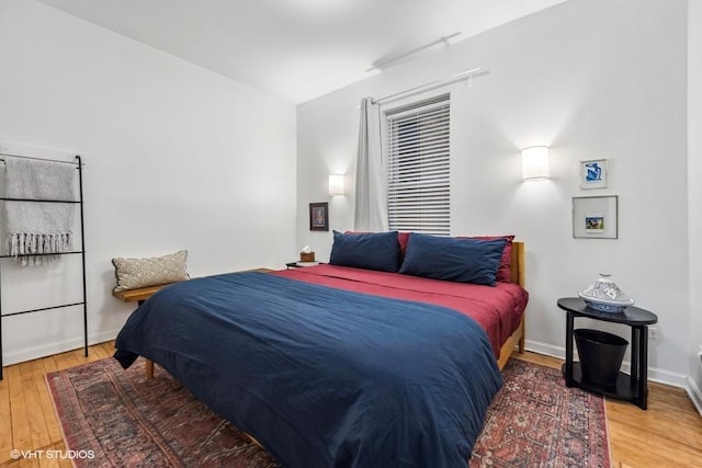 bedroom featuring wood-type flooring