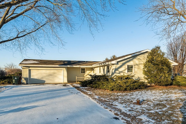 ranch-style house featuring a garage