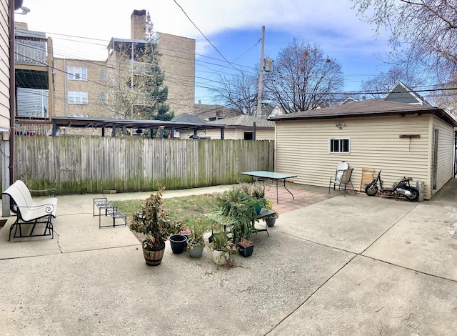 view of patio / terrace with an outbuilding