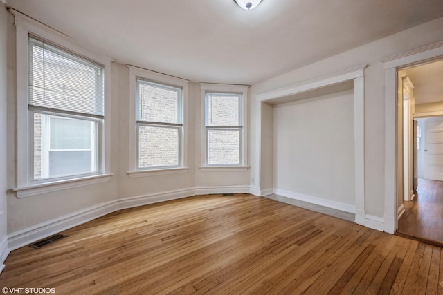 spare room with light wood-type flooring