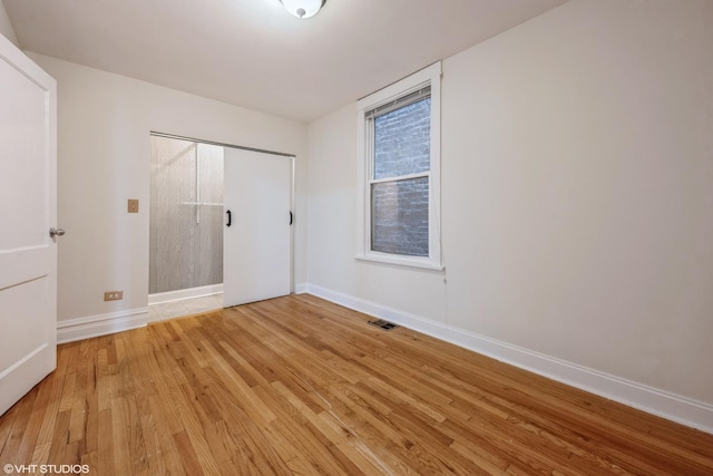 empty room featuring light hardwood / wood-style floors