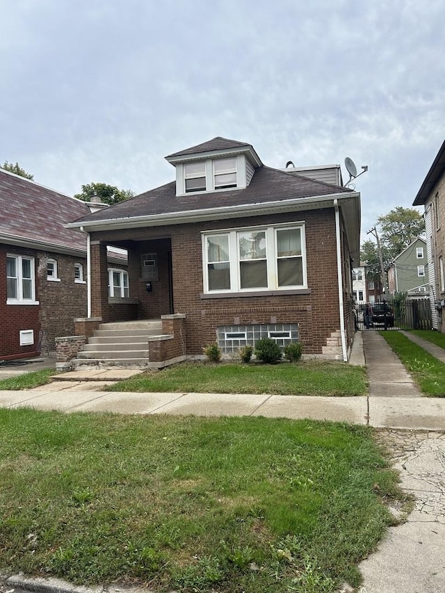 bungalow with a front yard