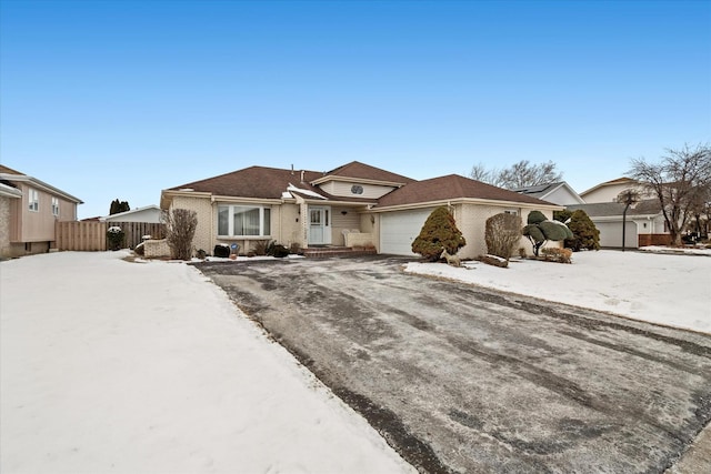 ranch-style house featuring a garage