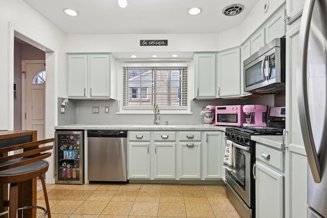 kitchen with stainless steel appliances and wine cooler