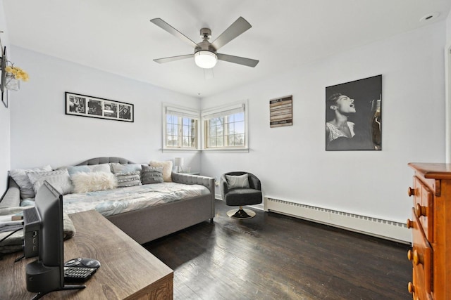 living room with hardwood / wood-style floors, ceiling fan, and baseboard heating