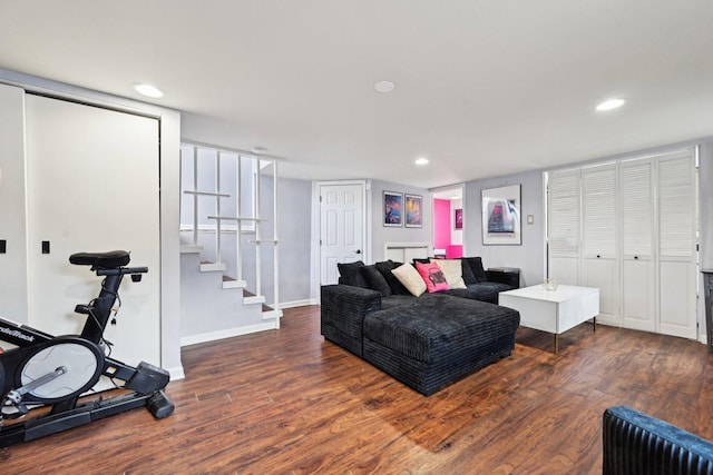 living room with dark hardwood / wood-style flooring