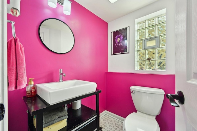 bathroom featuring toilet and sink