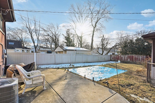 view of swimming pool with central AC and a patio