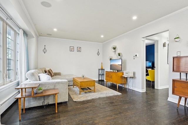 living room featuring ornamental molding, dark wood-type flooring, and a baseboard radiator