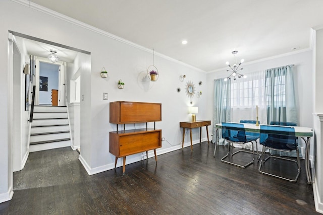 dining area featuring a notable chandelier, ornamental molding, and dark hardwood / wood-style floors