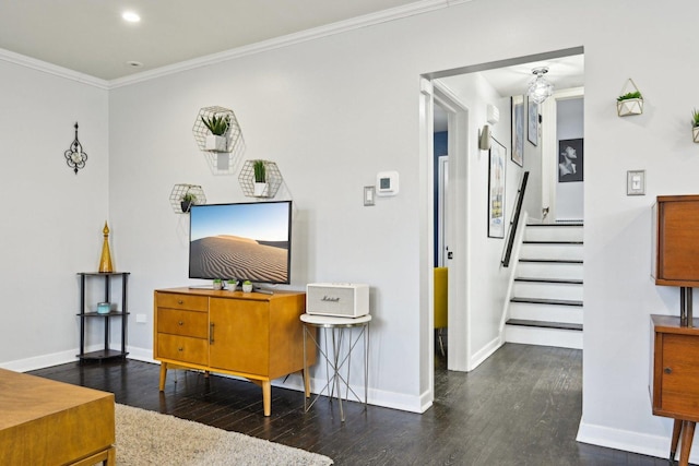 living room featuring dark wood-type flooring and ornamental molding