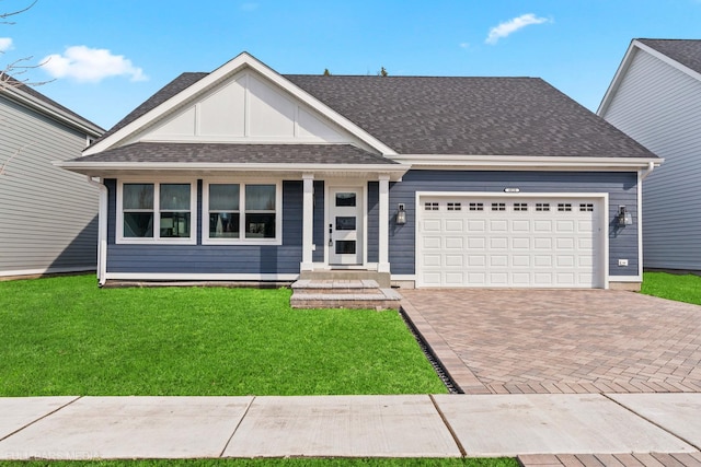 view of front facade with a front lawn and a garage