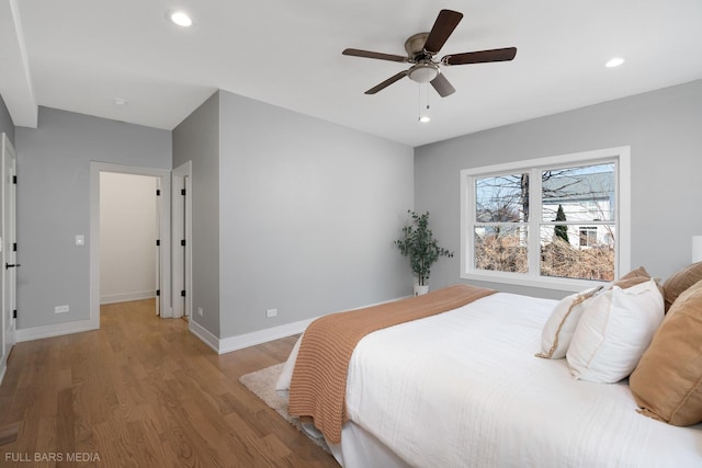 bedroom with ceiling fan and light wood-type flooring