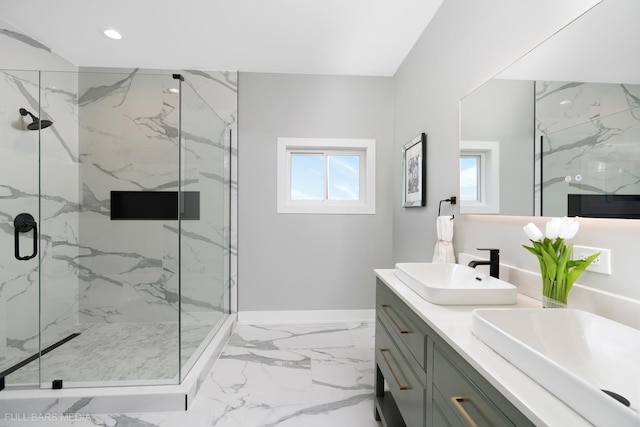 bathroom with vanity and a shower with door