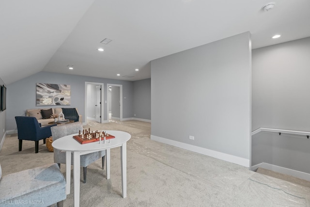 game room with vaulted ceiling