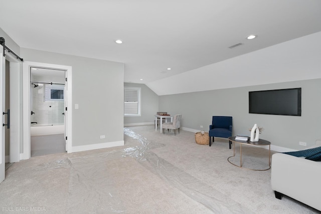 living area featuring light carpet and lofted ceiling