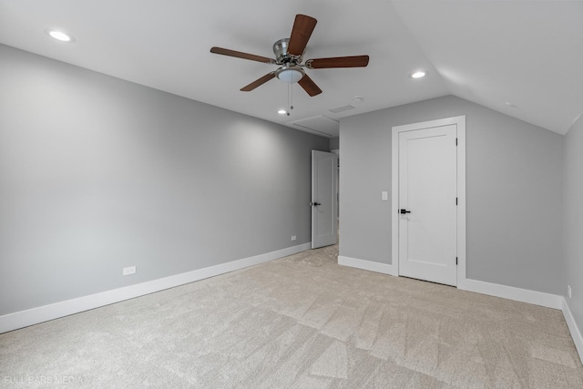 additional living space featuring light colored carpet, vaulted ceiling, and ceiling fan