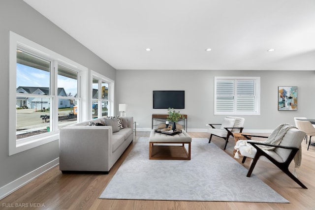 living room with light hardwood / wood-style floors