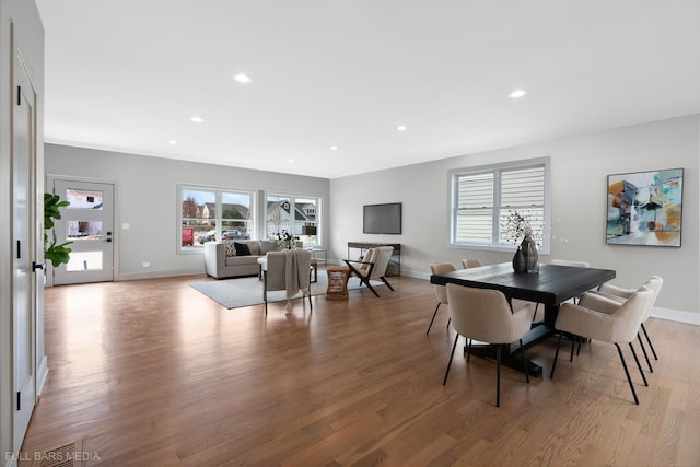 dining area with light hardwood / wood-style floors and plenty of natural light