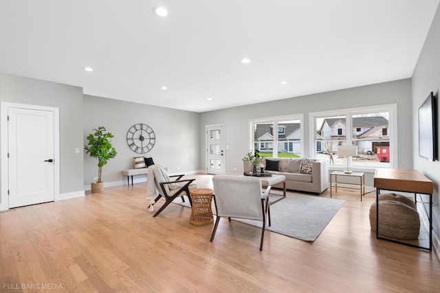 living room with light hardwood / wood-style flooring