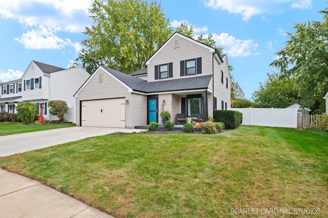 view of property with a garage and a front yard