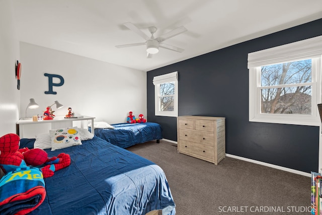 bedroom featuring dark carpet and ceiling fan