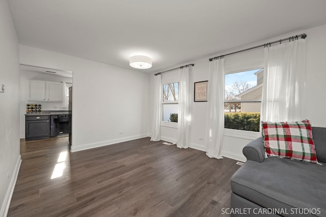 sitting room featuring dark hardwood / wood-style flooring