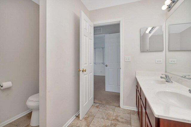 bathroom with vanity and toilet