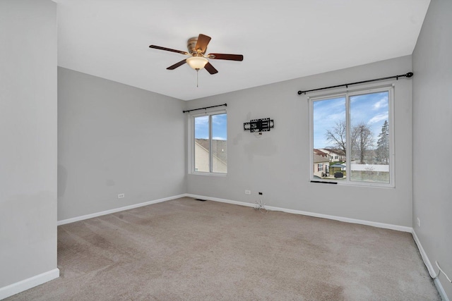 carpeted empty room with ceiling fan