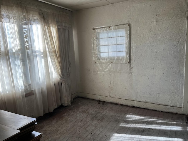 unfurnished room featuring hardwood / wood-style floors