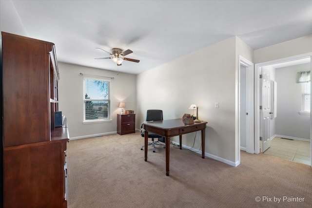 home office featuring ceiling fan and light colored carpet