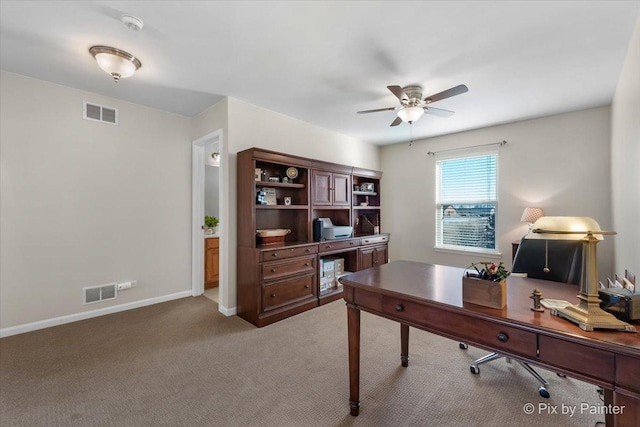 office space featuring carpet and ceiling fan