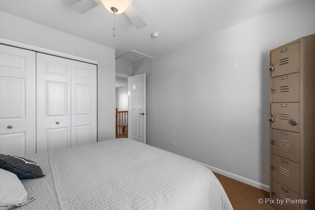 carpeted bedroom with ceiling fan and a closet