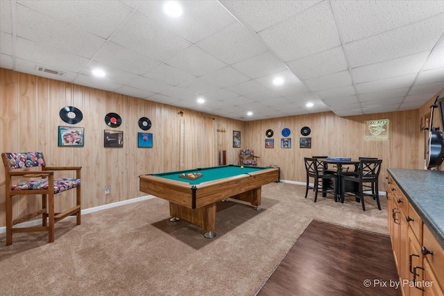 playroom featuring billiards, wooden walls, carpet floors, and a drop ceiling