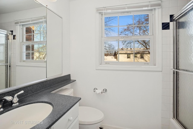 bathroom featuring toilet and vanity