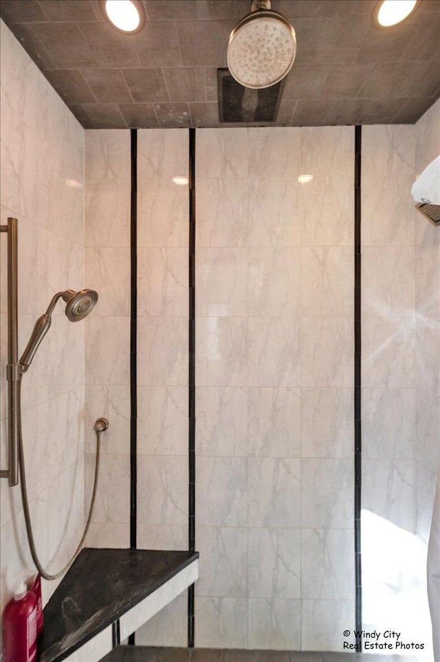 bathroom with a tile shower