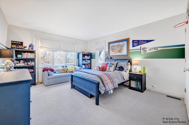 bedroom with light colored carpet