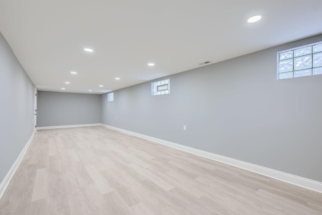 basement featuring light wood-type flooring