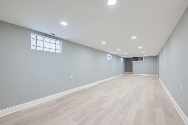 basement featuring light hardwood / wood-style flooring