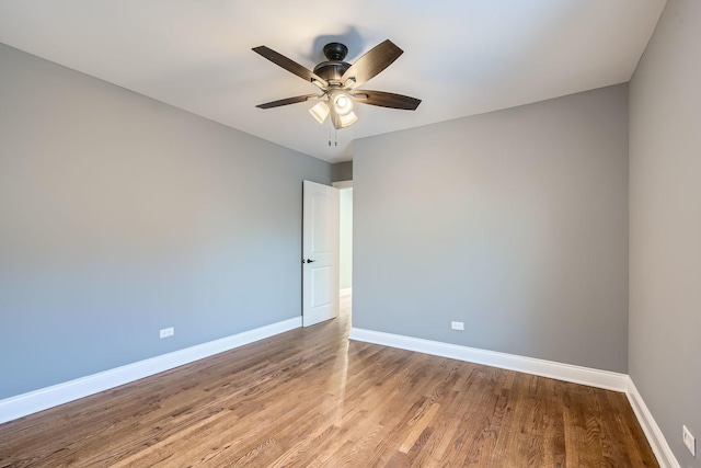 spare room featuring ceiling fan and light wood-type flooring