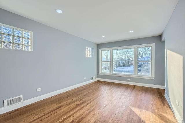 spare room featuring light hardwood / wood-style floors