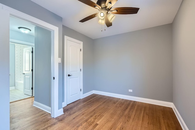 unfurnished room featuring ceiling fan and wood-type flooring