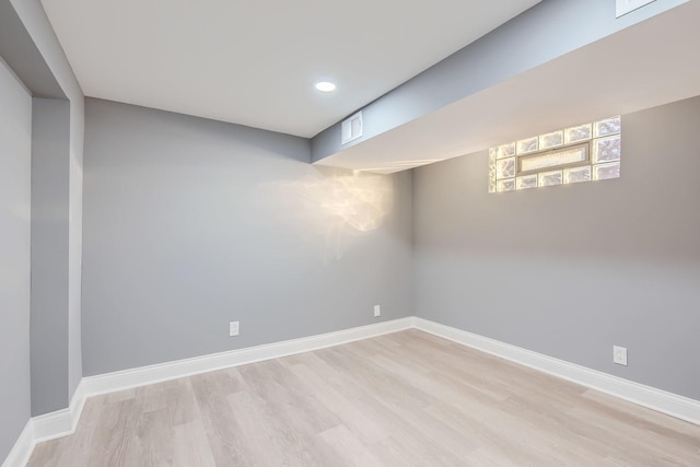 basement featuring light hardwood / wood-style floors