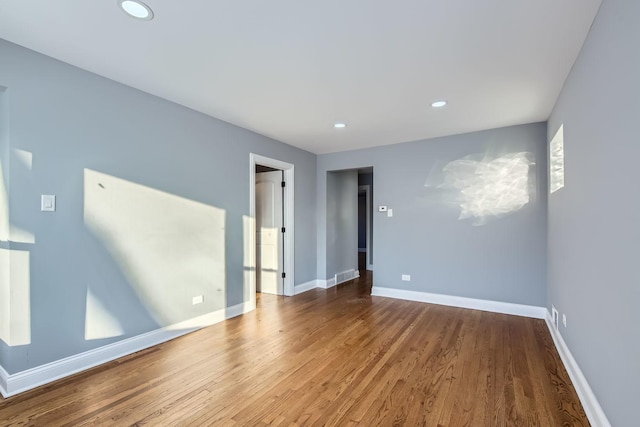 empty room featuring wood-type flooring