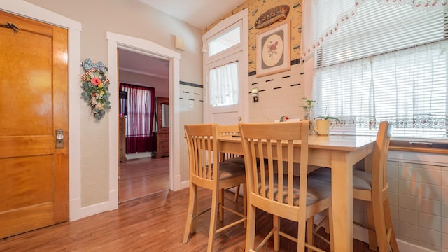 dining area with wood-type flooring