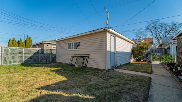 view of outbuilding with a yard