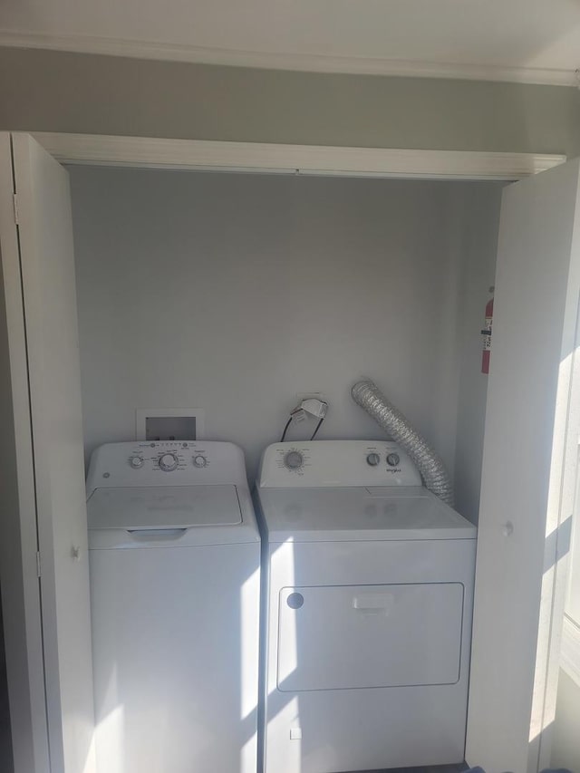 clothes washing area featuring washing machine and clothes dryer